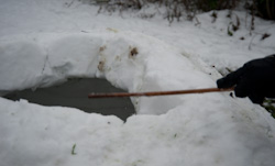 Build your own snow igloo - shaving off excess snow